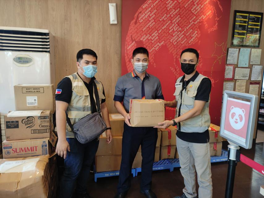 PDRF Operations Team hands over the donations from Jollibee Group Foundation to Jollibee Tacloban