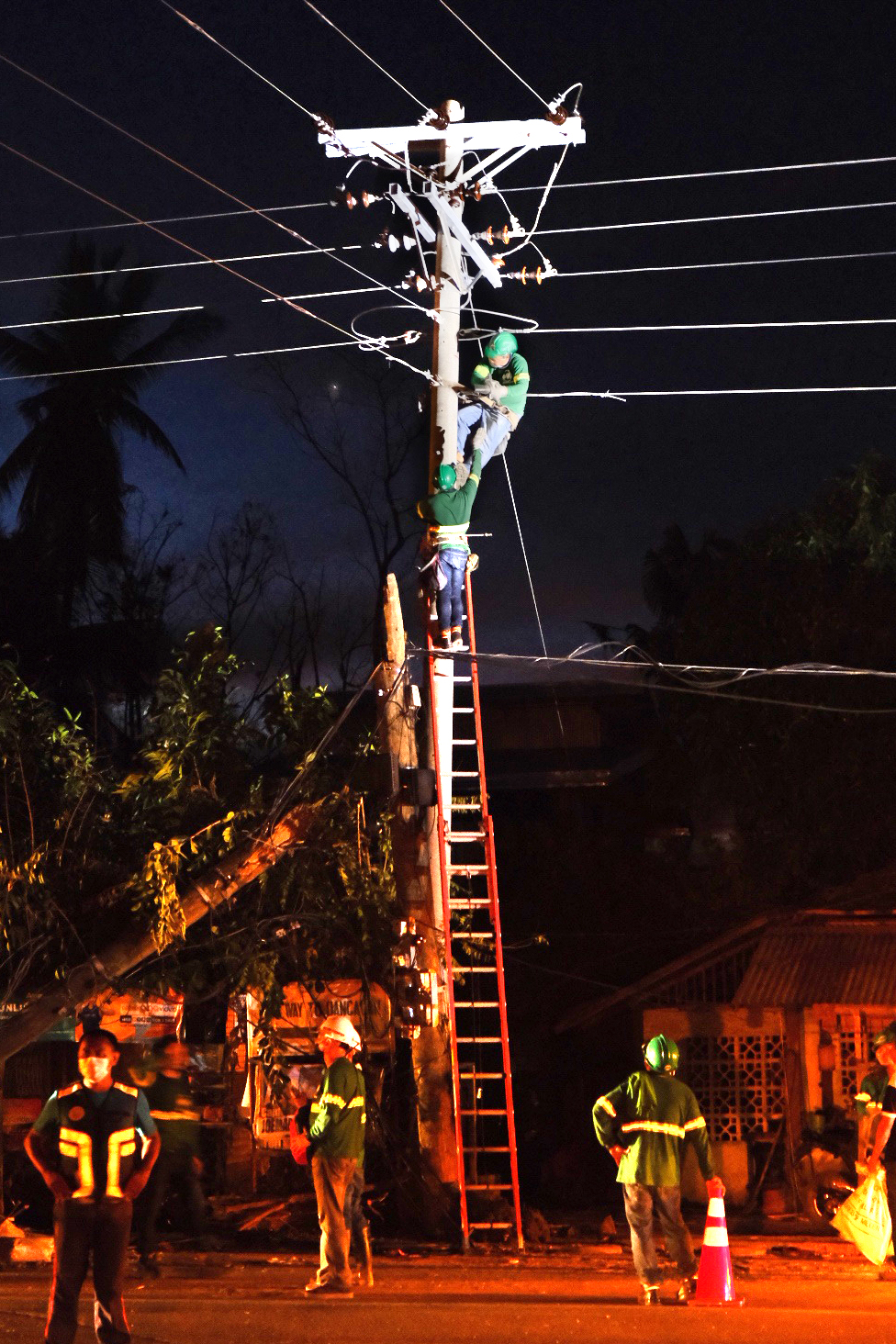 Power restoration teams repairing electric lines